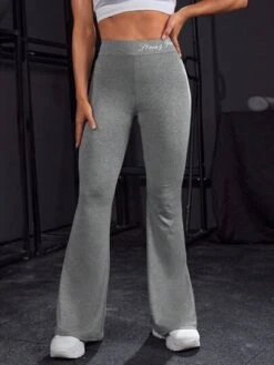 Letter Graphic Flare Leg Sports Pants -Gym Chic Wear 16883656946ea7cfbd827228298151397ca98e58ae thumbnail 405x552